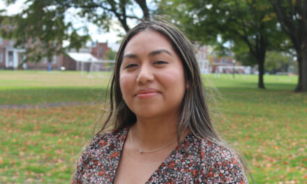 Student Leticia Aguilar-Perez speaks at alumni event at Big E